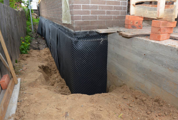 Happy homeowners after waterproofing job in Dale